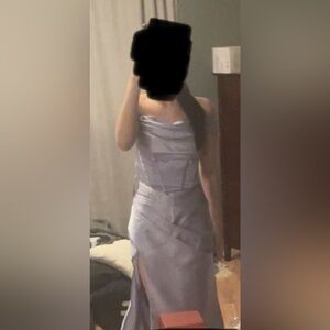 Lavender satin prom dress with ruched waist. Floor length and corset back